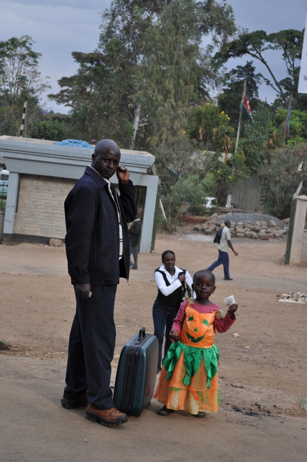 A child in a pumpkin dress in Kibera slum